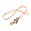 Bohemian braided faux leather skinny belt for women in camel, perfect for casual and formal outfits with fringe accents.
