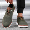 Top view of men's knitted walking shoes showing breathable mesh pattern and lace system