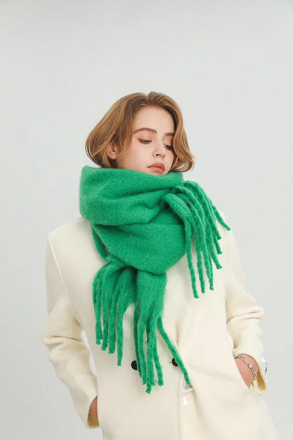 Luxurious cashmere-feel scarf in forest green with elegant tassels.