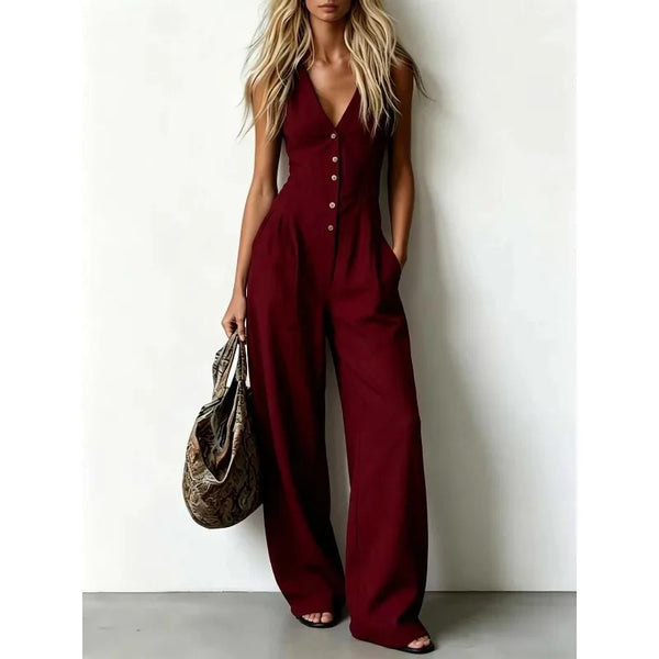 Full length view of blue denim jumpsuit with V-neck and vintage-inspired button closure