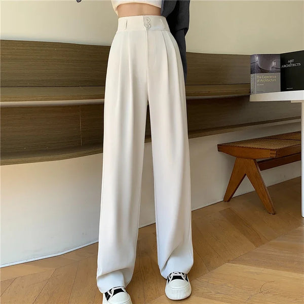 Full length view of high-waist trousers showing versatile styling with cropped top and modern wide leg shape