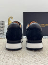 Billionaire loafers in black leather, perfect for spring wear.