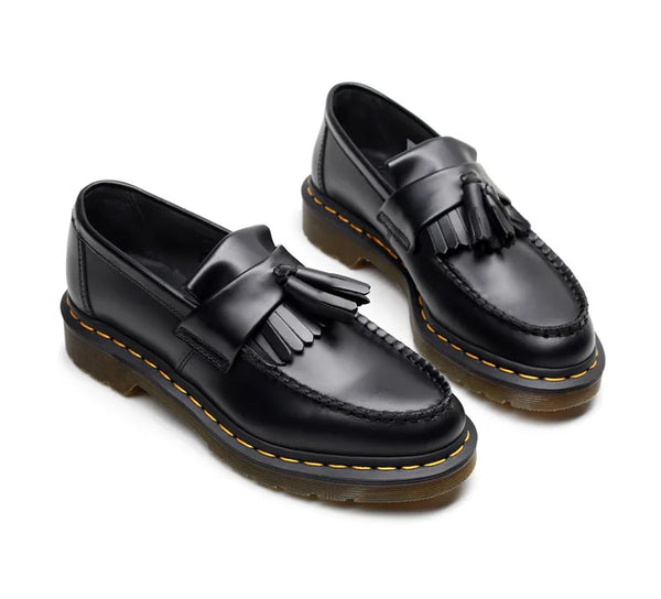 Black tassel loafers with a focus on comfort and elegance.
