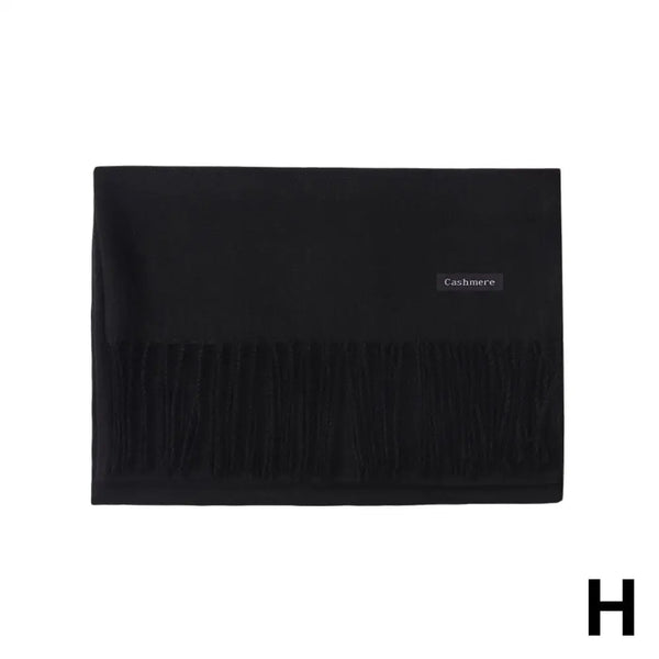 Versatile black winter scarf, can be worn as a shawl or neck scarf.