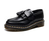 Top view of black tassel loafers emphasizing the sleek design.