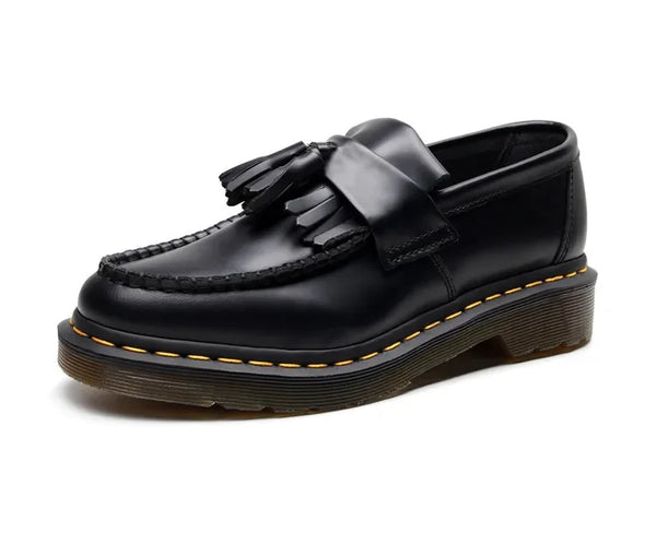 Top view of black tassel loafers emphasizing the sleek design.