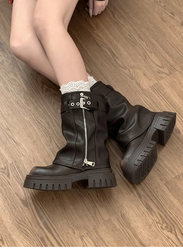 Chic women's mid-calf biker boots with buckle detail, cozy plush lining, and durable rubber sole for stylish winter wear.