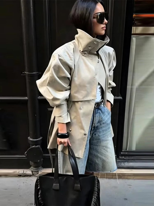 Modern khaki trench coat with turtleneck-inspired collar and structured silhouette