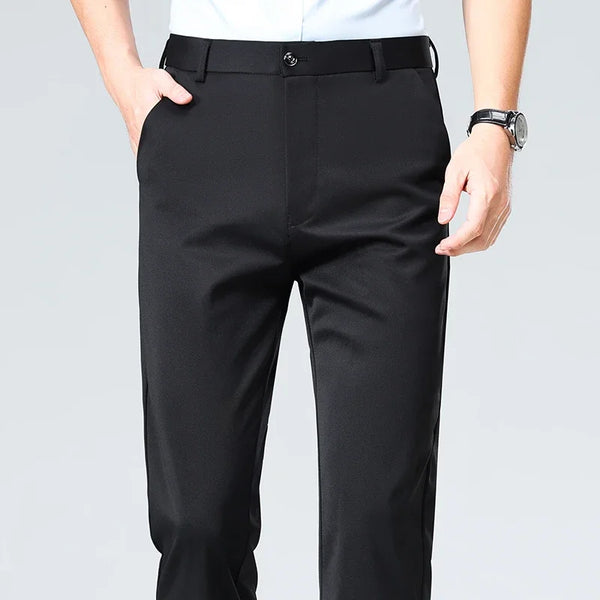 Modern professional wearing breathable polyester dress pants with stretch technology in office setting