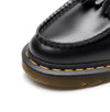 Black tassel loafers that combine tradition with modern comfort.