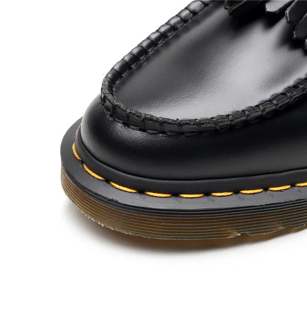 Black tassel loafers that combine tradition with modern comfort.