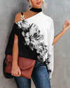Elegant floral print blouse with batwing sleeves, halter collar, and soft cotton-polyester blend for all-day comfort.