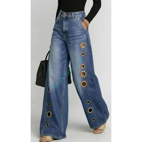 Wide leg denim jeans featuring high waist fit and contemporary metal grommet accents