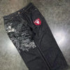 Artistic flair in blue denim wide-leg jeans for fashion-forward wear.