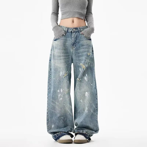 Trendy washed and ripped wide-leg women's jeans with distressed finish, mid-rise fit, and comfortable cotton-spandex blend.