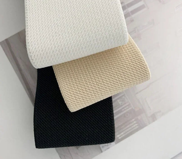 Chic round buckle women's elastic waist belt in neutral color, perfect for dresses, sweaters, and casual outfits.