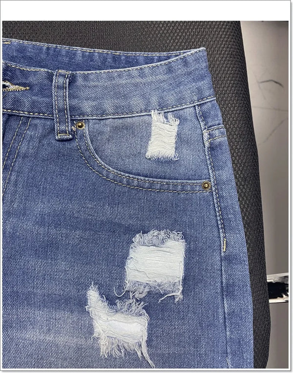 Women's distressed denim shorts with five-button fly and comfortable regular fit
