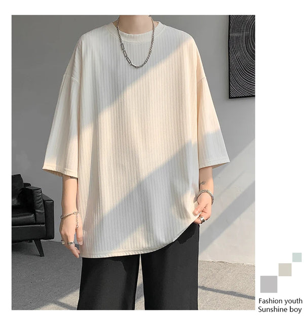 Detail of soft O-neck on striped summer tee, ensuring comfort for all-day wear.