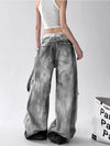 Trendy high-waist wide-leg ripped jeans for women with tie-dye and distressed detailing, perfect for casual street style.