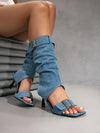 Statement-making open-toe boots with mid-calf height and mixed materials