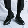 Close-up of men's leather dress loafer showing premium construction and texture