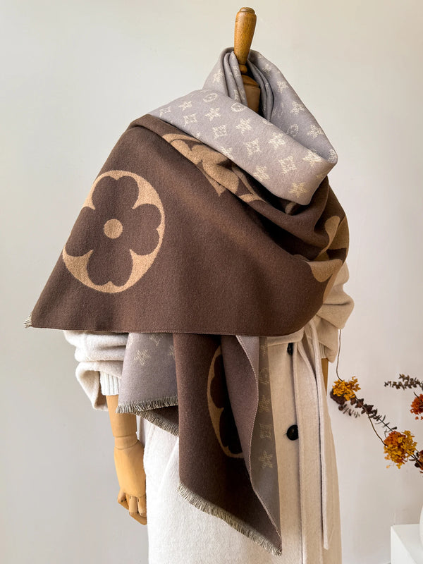 Detail of the plush fabric of the Winter Whispers shawl against a snowy backdrop.