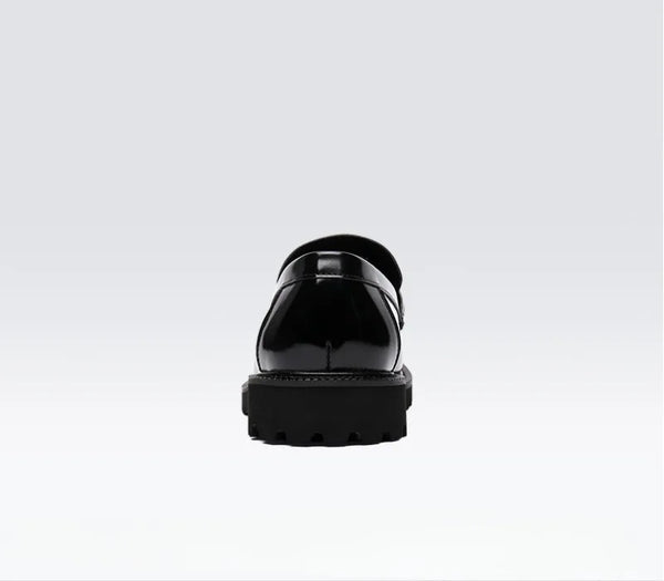 Black Oxfords with buckle detail, ideal for professional attire.