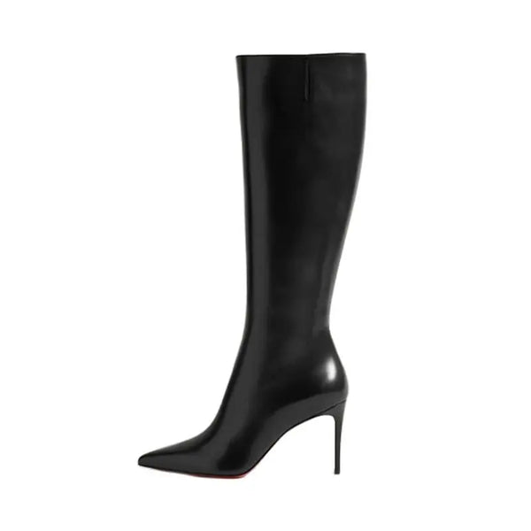 Brown designer boots with a pointed toe for a chic look.