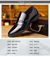 Lace-up closure of elegant black leather Oxford brogue shoes.