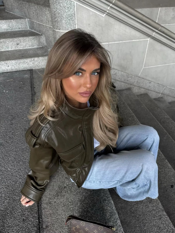 Chic army green faux leather jacket for women with stand collar, loose fit, and functional pockets, perfect for winter style.