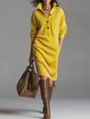 Flat lay of the Fireside Chic dress with autumn leaves, showcasing seasonal style.