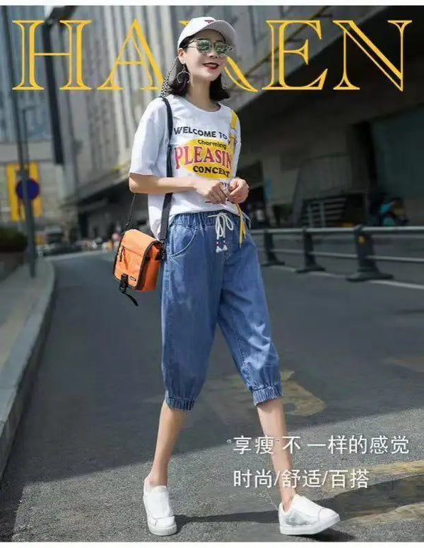High-waist harem jeans with functional pockets and versatile calf-length design
