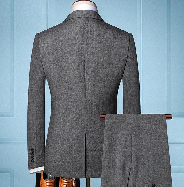 Model wearing the trio suit set, exuding a commanding presence.
