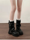 Chic women's mid-calf biker boots with buckle detail, cozy plush lining, and durable rubber sole for stylish comfort.