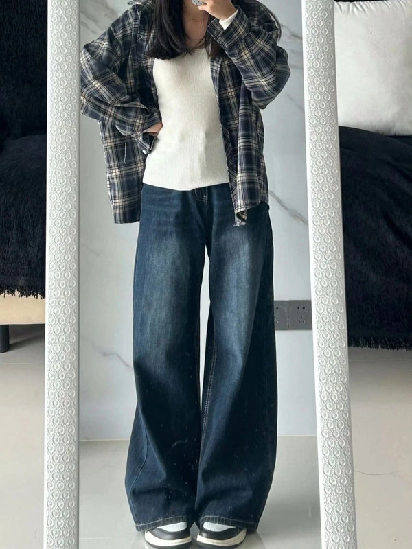 Woman wearing throwback early 2000s inspired high-waisted baggy jeans with relaxed straight leg fit
