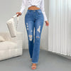 Chic light blue ripped flared jeans for women with high waist, deep pockets, and stylish retro flair. Perfect for casual outi