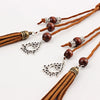 Bohemian braided faux leather skinny belt for women in camel, perfect for casual and formal outfits with fringe accents.