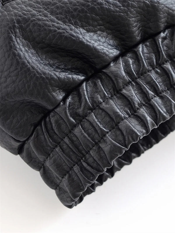 Chic black faux leather moto jacket for women, perfect for autumn evenings and stylish casual wear. Durable and fashionable.