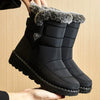 Chic women's waterproof winter boots with plush lining, low heel, and hook-and-loop closure for stylish cold weather comfort.