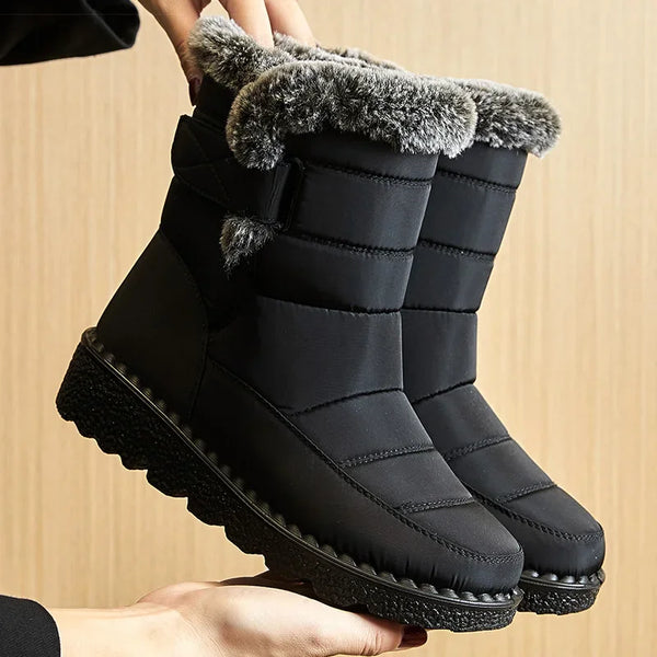 Chic women's waterproof winter boots with plush lining, low heel, and hook-and-loop closure for stylish cold weather comfort.
