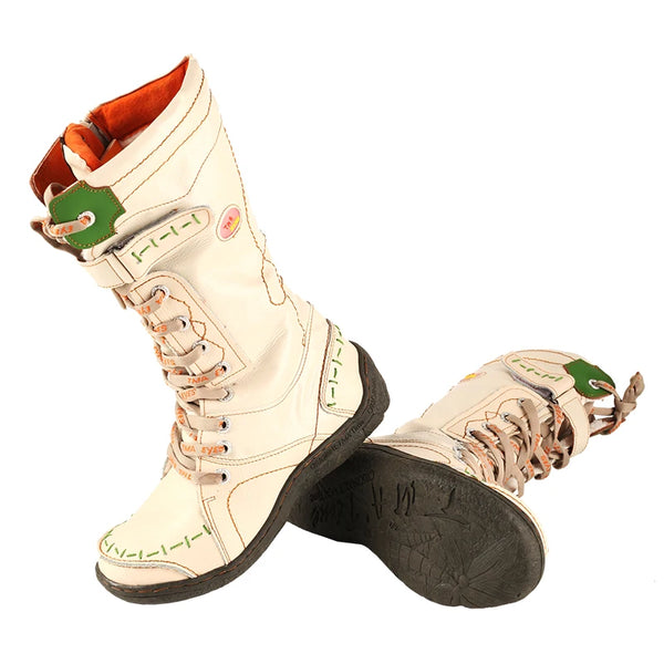 Brown leather snow boots with handmade stitching and comfortable flat sole