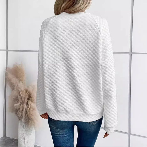 Woman wearing relaxed fit deep V-neck hoodie with casual styling