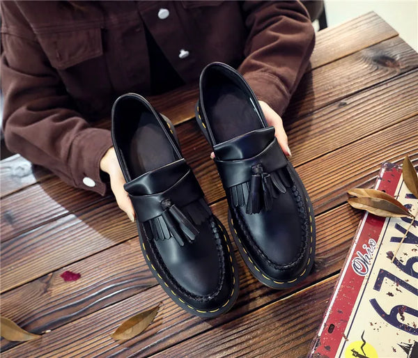 Black tassel loafers that transition effortlessly from day to night.