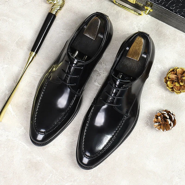 Elegant black leather Oxfords ideal for formal and business settings.