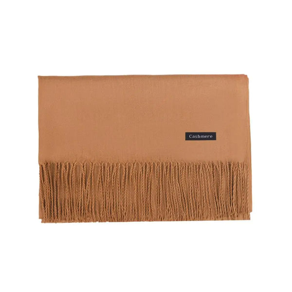 Versatile black scarf with tassel trim, perfect for any winter occasion.