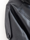 Chic black faux leather moto jacket for women, perfect for autumn evenings and stylish casual wear with functional pockets.