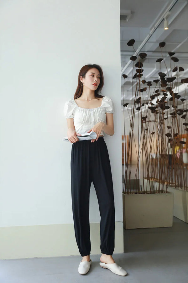 Comfy modal women's pajama pants with elastic waistband, ankle-length design, perfect for lounging and sleep in all seasons.