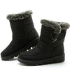 Chic women's waterproof winter boots with plush lining, low heel, and secure hook-and-loop closure for cold weather comfort.