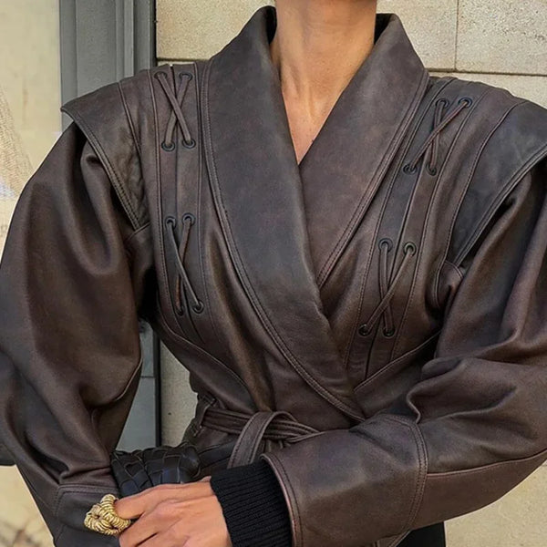 Chic belted leather bomber jacket for women, featuring lace-up detail, hood, and notched lapel, perfect for autumn and winter