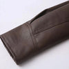 Chic belted leather bomber jacket for women, featuring lace-up detail and hood, perfect for autumn and winter fashion.